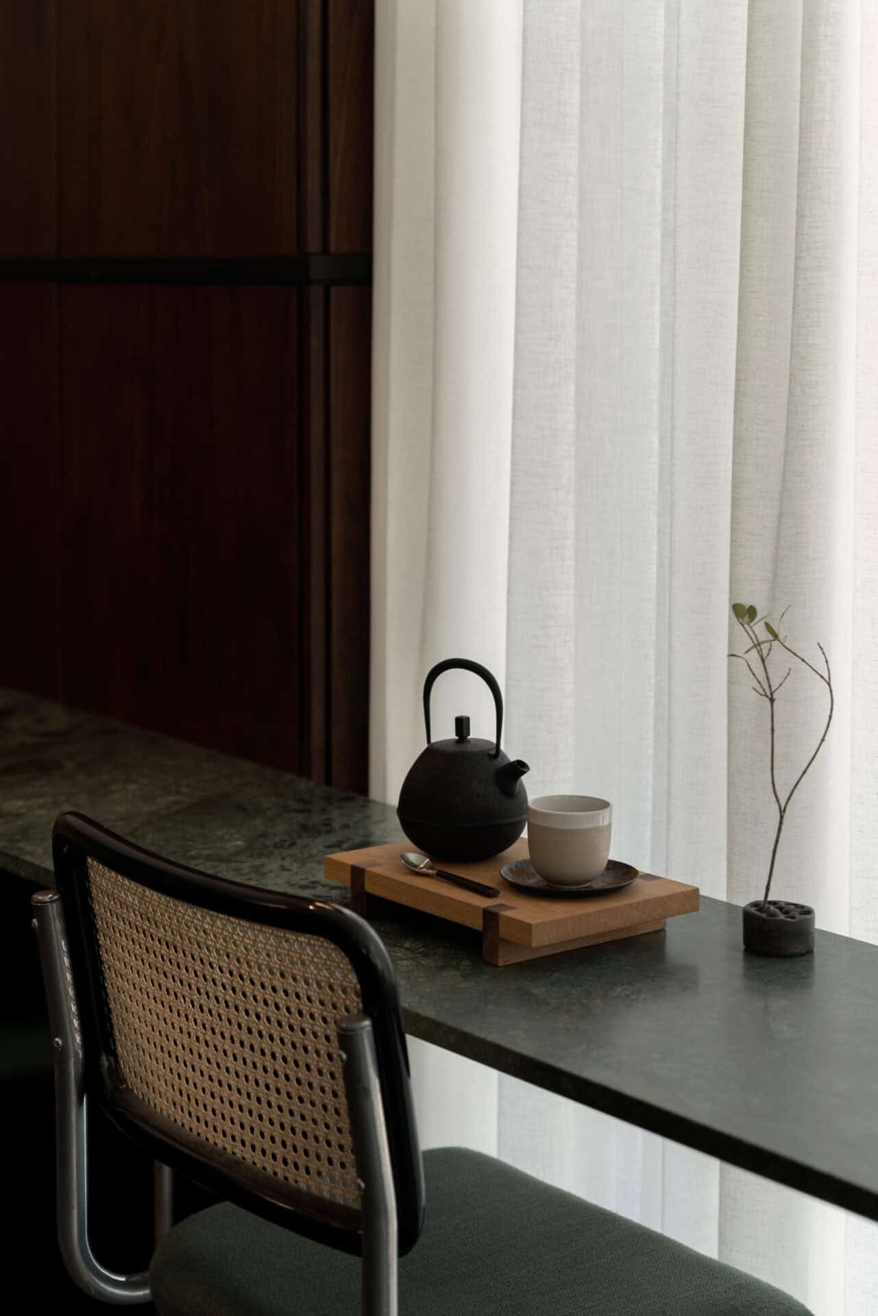 Window counter at Rosetta Roastery set with a teapot and cup on a timber tray